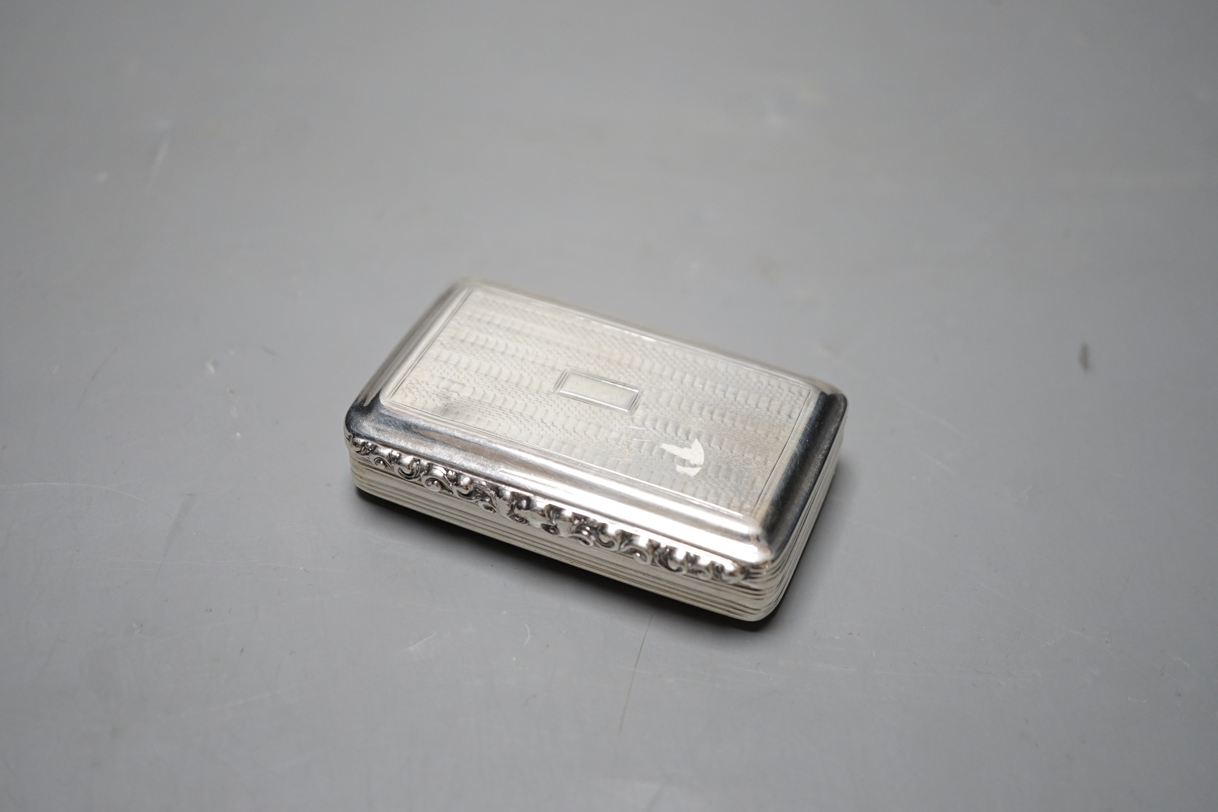 A William IV engraved silver rectangular snuff box, Edward Smith, Birmingham, 1832, 75mm.